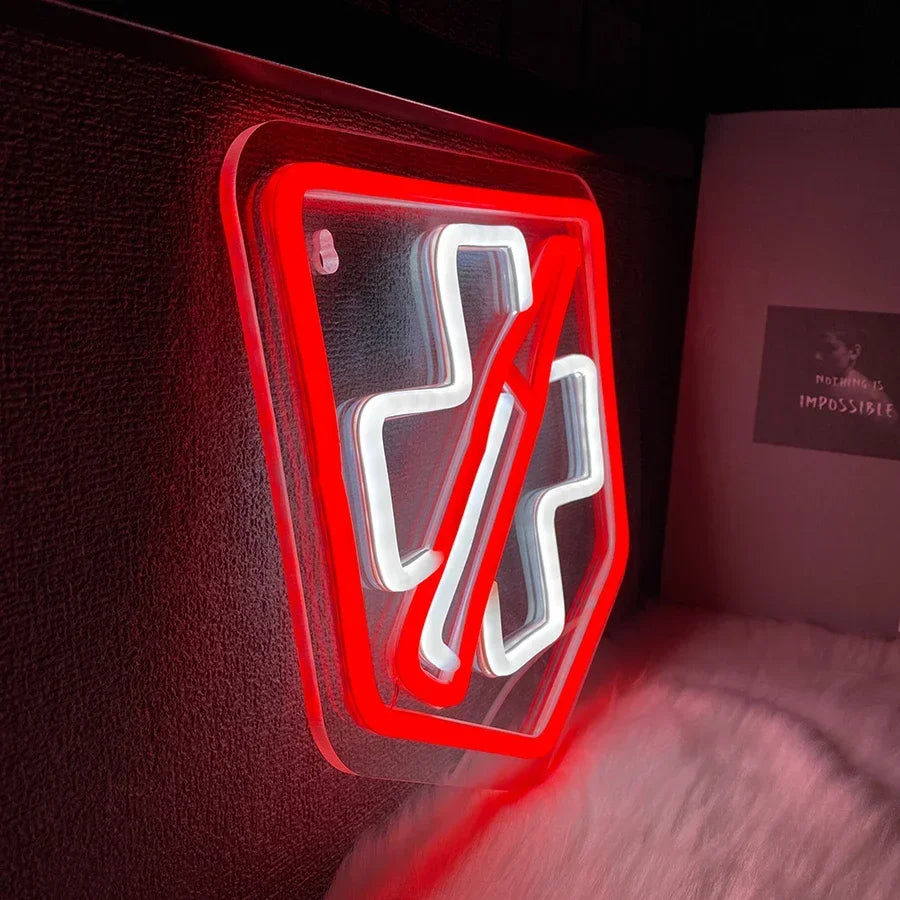 Close-up side angle of the Call of Duty Juggernog perk neon sign glowing red and white, mounted on a dark wall in a gaming room setup
